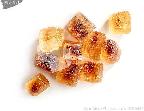 Image of Brown caramelized sugar cubes on a white background 