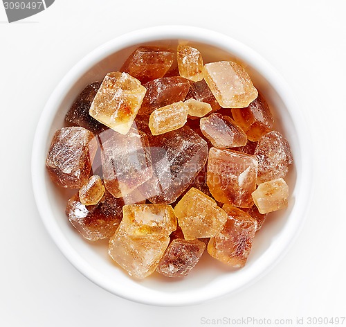 Image of Brown caramelized sugar cubes on a white background 