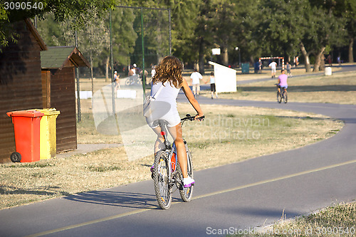 Image of Woman riding a bicycle