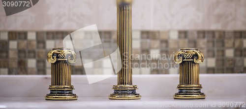 Image of golden faucet 