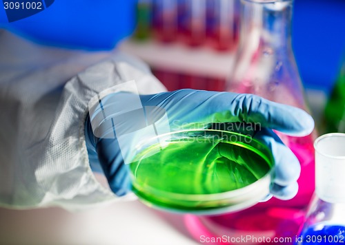 Image of close up of scientist making test in laboratory