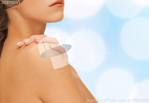 Image of beautiful young woman with bare shoulders
