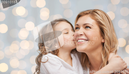 Image of happy mother and daughter hugging