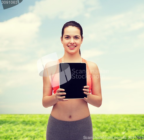 Image of sporty woman with tablet pc blank screen