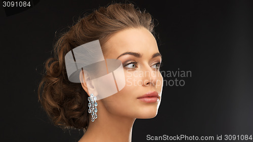 Image of woman with diamond earrings