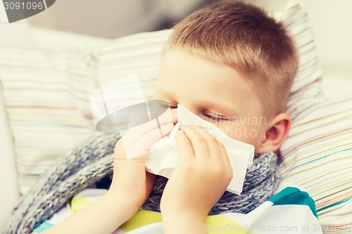 Image of ill boy with flu at home