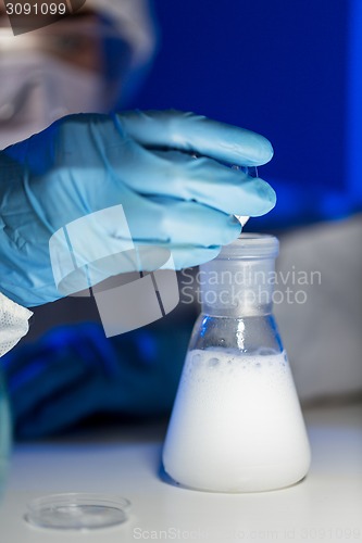 Image of close up of scientist making test in lab