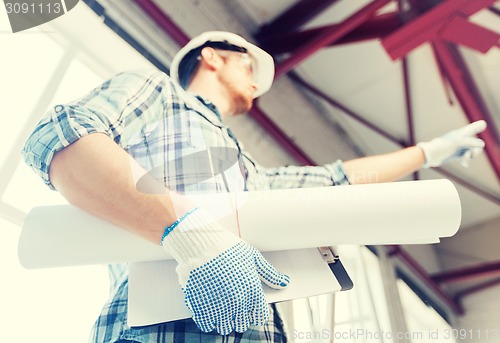 Image of man with blueprint