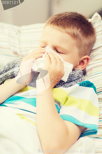 Image of ill boy with flu at home