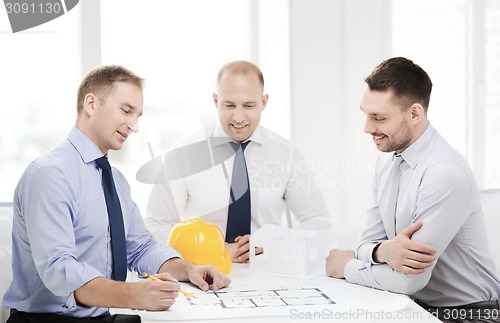 Image of happy team of architects and designers in office