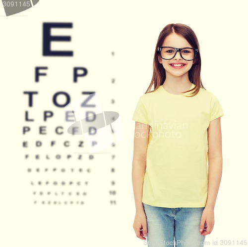 Image of smiling cute little girl in black eyeglasses