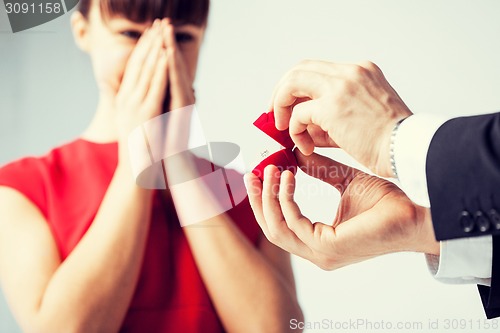 Image of couple with wedding ring and gift box