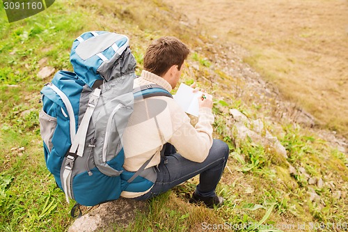 Image of man with backpack hiking