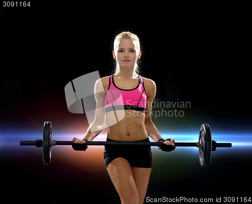Image of sporty woman exercising with barbell