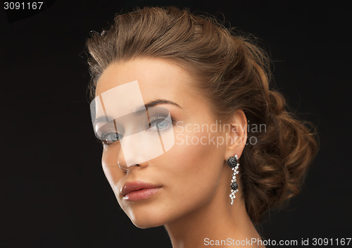 Image of woman with diamond earrings