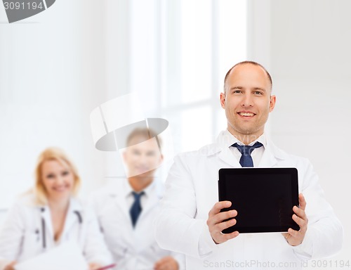 Image of smiling male doctor with tablet pc