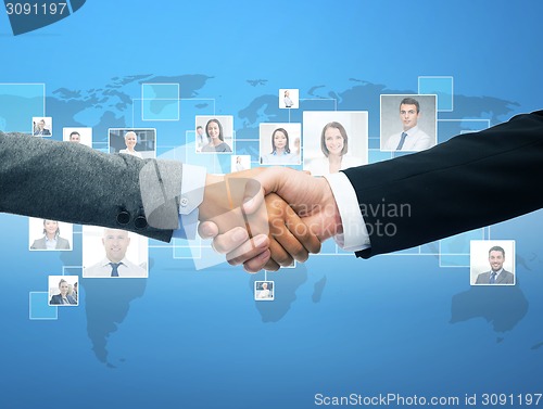 Image of businessman and businesswoman shaking hands