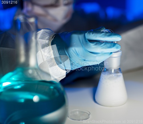 Image of close up of scientist making test in laboratory