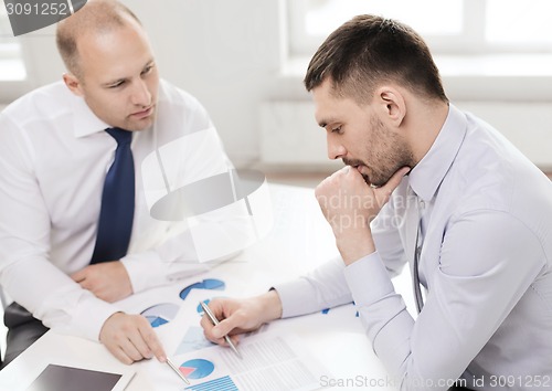 Image of two businessmen having discussion in office