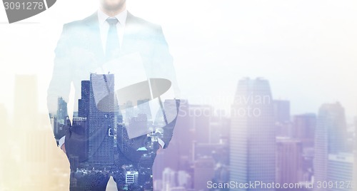 Image of close up of businessman over city background