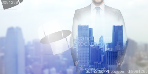 Image of close up of businessman over city background