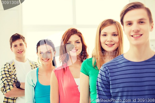 Image of smiling male student with group of classmates