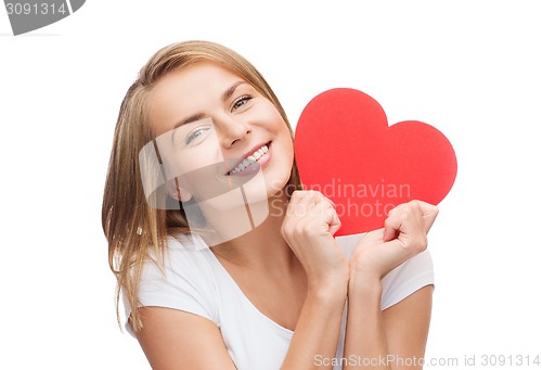 Image of smiling woman in white t-shirt with heart