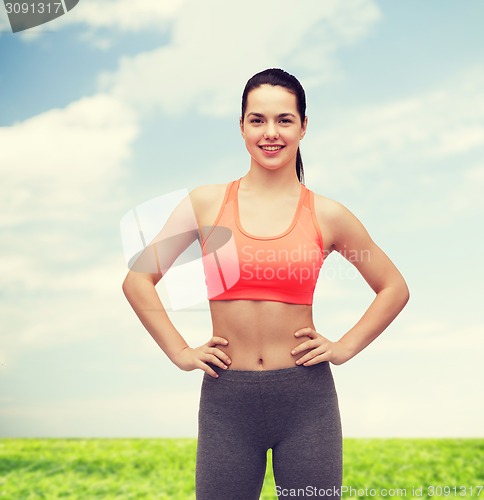 Image of smiling teenage girl in sportswear
