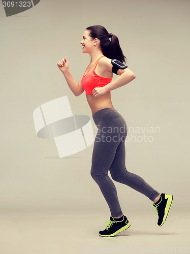 Image of sporty woman running or jumping