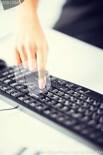 Image of woman hands typing on keyboard