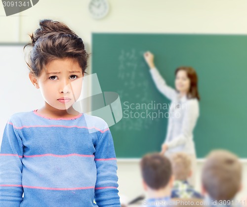 Image of sad little school girl