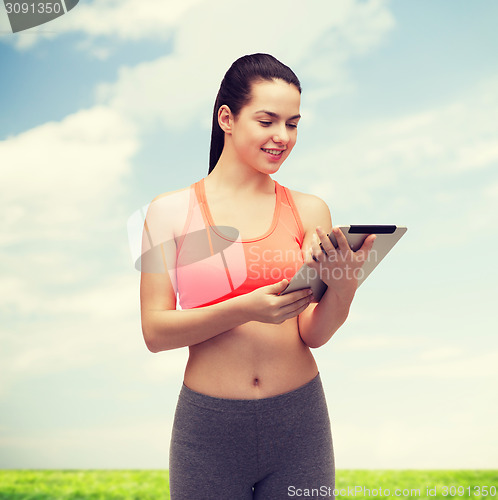 Image of sporty woman with tablet pc computer