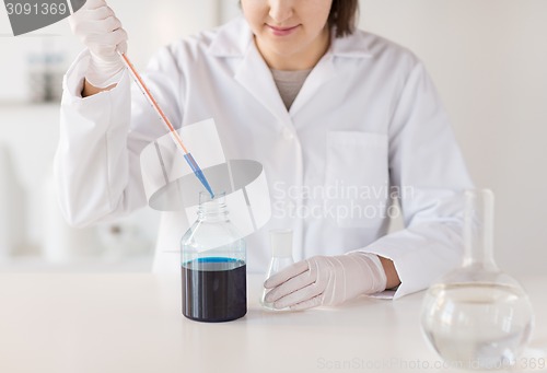 Image of close up of scientist making test in lab