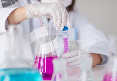 Image of close up of scientist making test in lab