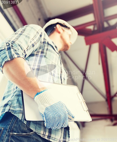 Image of man with blueprint