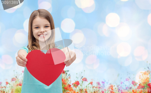 Image of smiling girl with red heart natural background