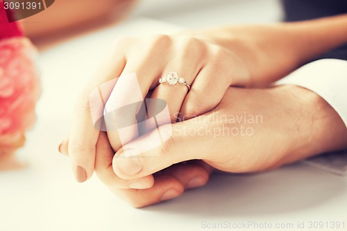 Image of man and woman with wedding ring