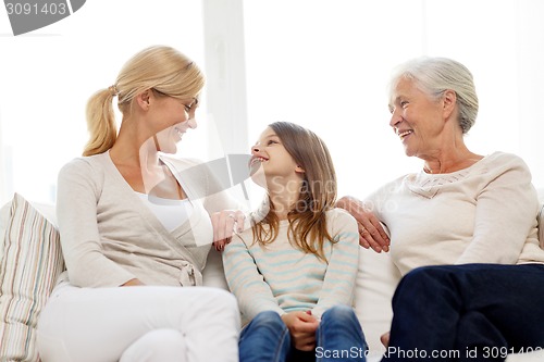 Image of smiling family at home