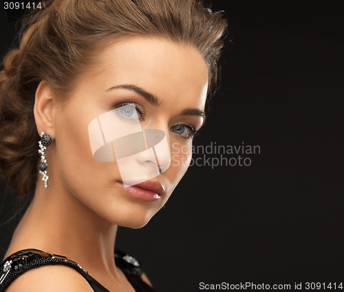 Image of woman with diamond earrings