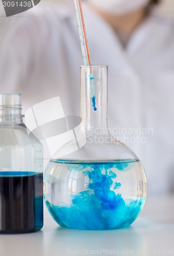 Image of close up of scientist making test in lab