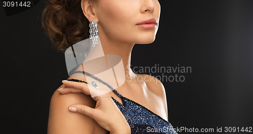 Image of woman with diamond earrings