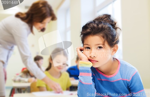 Image of sad or bored little school girl