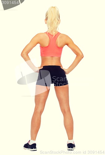 Image of athletic woman in sportswear from the back
