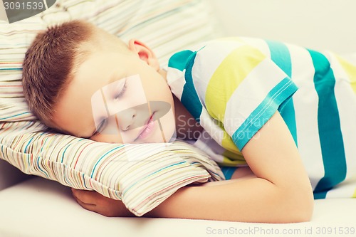 Image of little boy sleeping at home