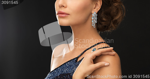 Image of woman with diamond earrings