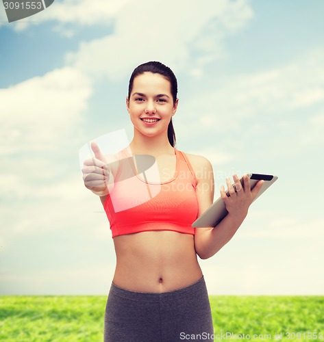 Image of sporty woman with tablet pc computer
