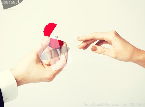 Image of couple with wedding ring and gift box