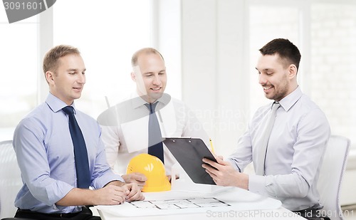 Image of happy team of architects and designers in office