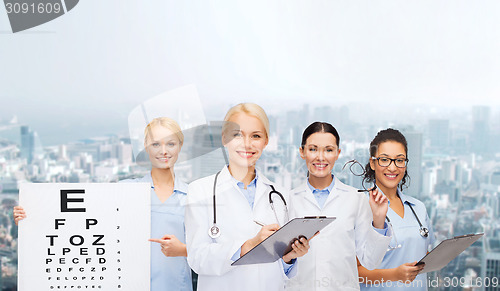 Image of smiling female eye doctors and nurses