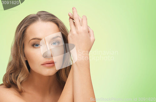 Image of beautiful woman face and hands